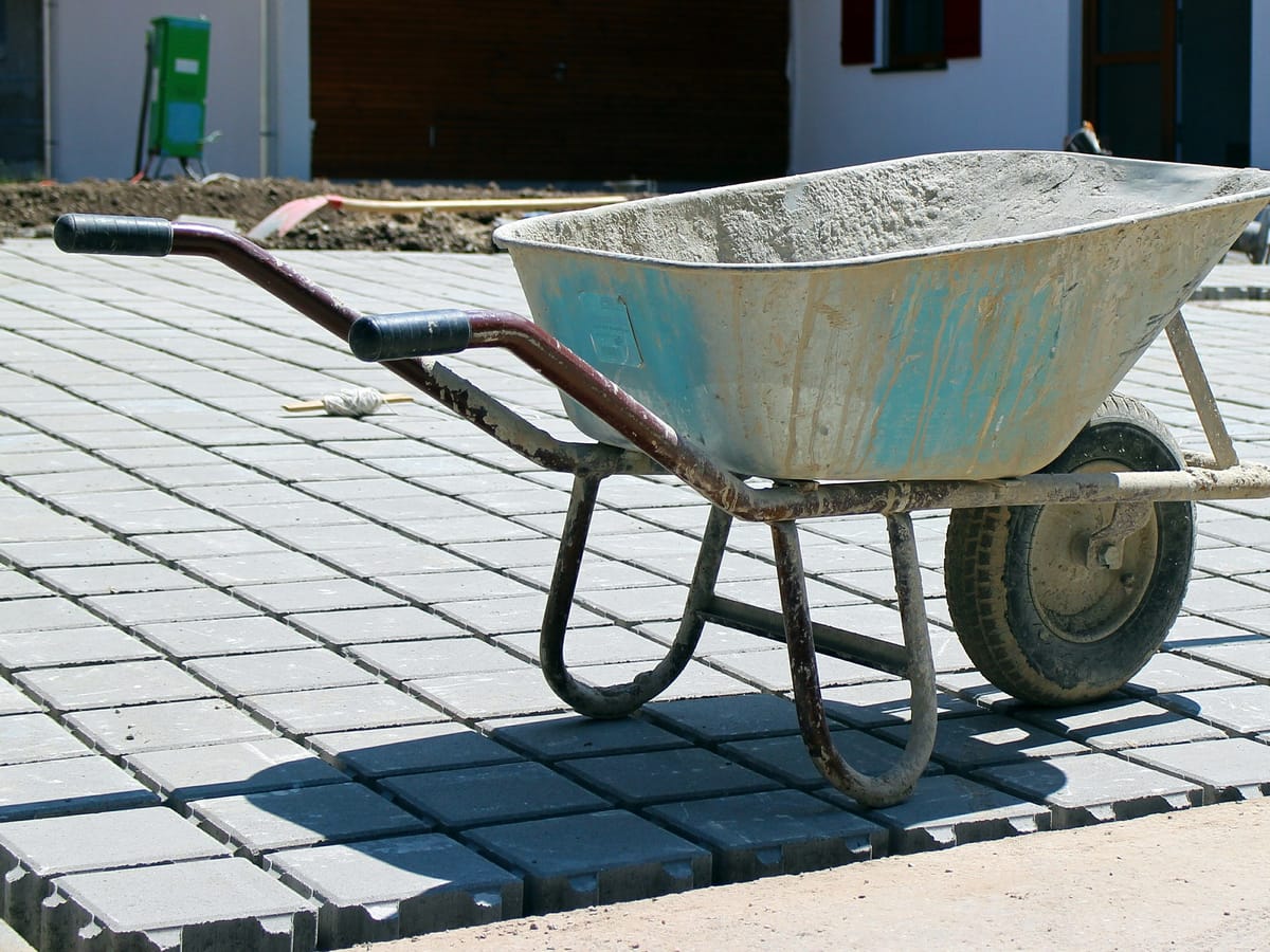 A Smart Call Contractors landscaper laying a patio at a Lincolnshire home